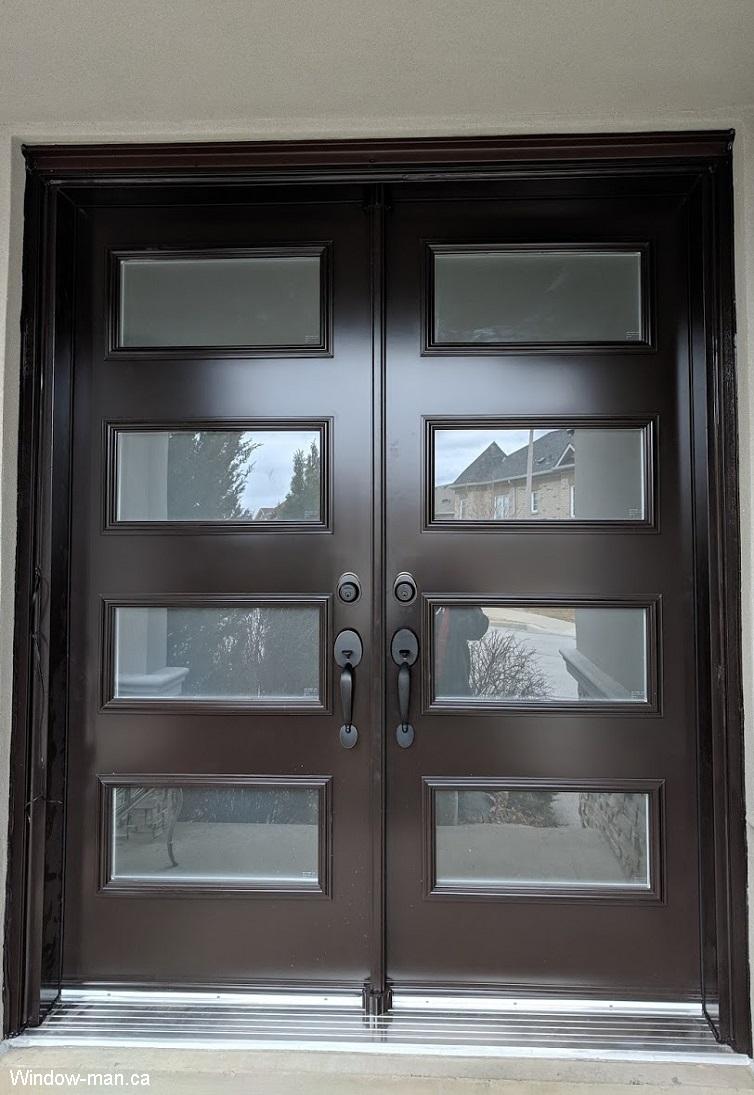 Double entry steel insulated brown front exterior doors installation. Modern stylish shaker style door. Acid etched glass Privacy Glass. 4 lite. Lorraine retro collection shaker style.